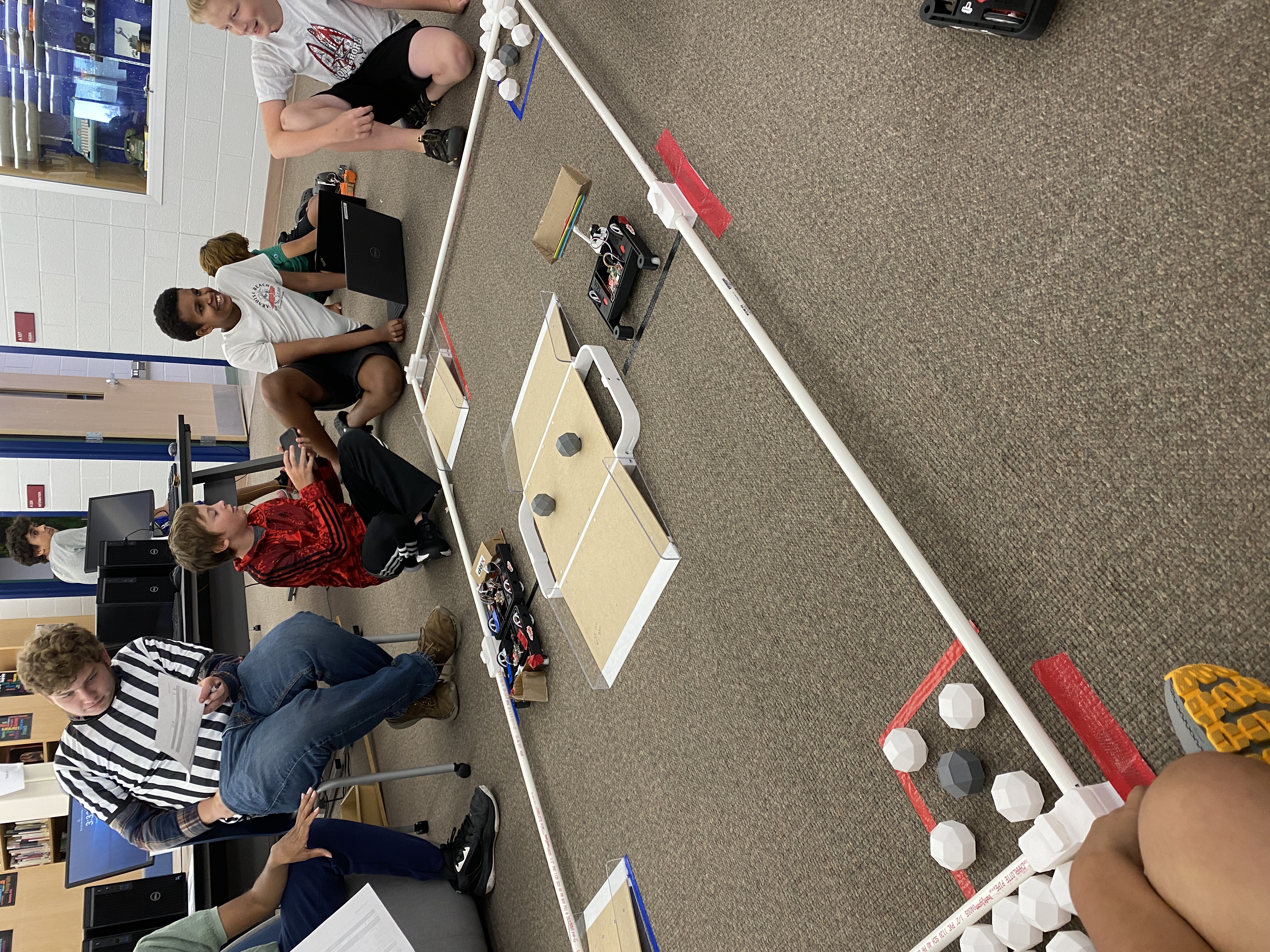 Middle school students working with XRP robots